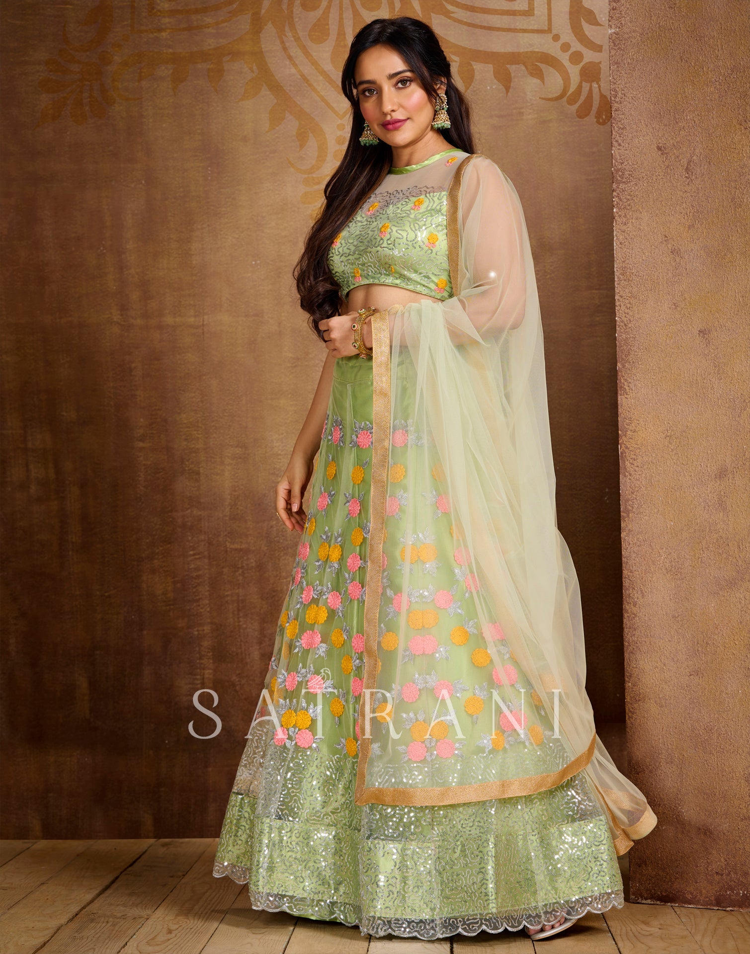Pista Cream Coloured Net Sequence Embroidered Partywear Lehenga | SLV125L10496