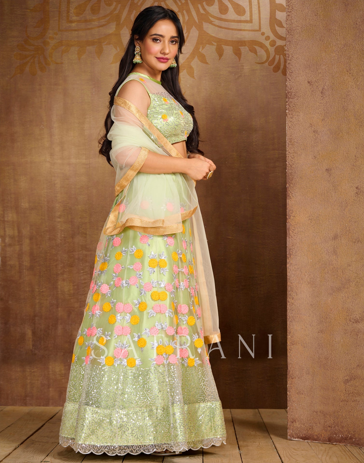 Pista Cream Coloured Net Sequence Embroidered Partywear Lehenga | SLV125L10496